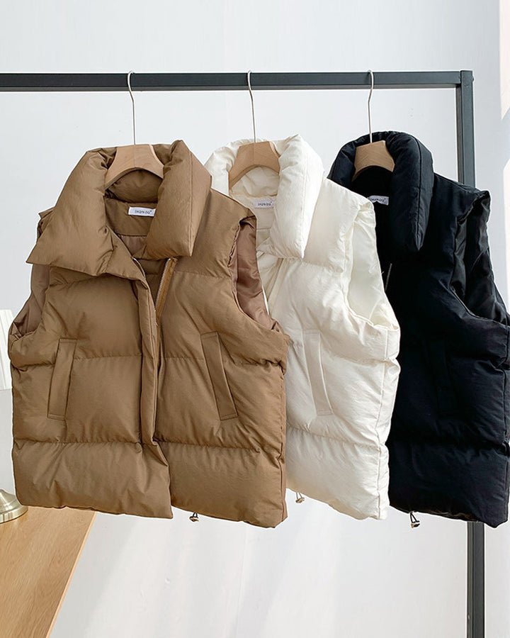 Veste matelassée simple sans manches avec poche zippée de couleur unie