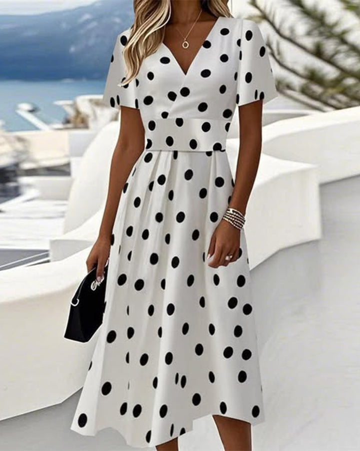 Robe élégante en coupe A avec col V et pois